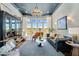 Eclectic living room featuring a piano, drum set, and stylish decor at 4037 E Minton Cir, Mesa, AZ 85215