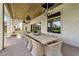 Covered patio featuring an outdoor dining area with hanging lanterns and a beautiful wood ceiling at 4037 E Minton Cir, Mesa, AZ 85215