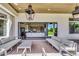 Spacious outdoor patio with comfortable seating and a view of the lush backyard at 4037 E Minton Cir, Mesa, AZ 85215
