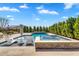 Inviting pool area with built-in spa, tanning ledge, and outdoor seating at 4037 E Minton Cir, Mesa, AZ 85215