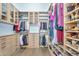 Spacious walk-in closet with custom shelving and ample storage space at 4037 E Minton Cir, Mesa, AZ 85215