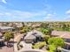 Aerial view of the home showcases the landscaped yard, community, and desirable neighborhood at 4638 S San Benito Ct, Gilbert, AZ 85297