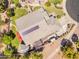 Aerial view of the property featuring a rooftop solar panel and backyard patio at 4638 S San Benito Ct, Gilbert, AZ 85297