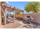 Outdoor pergola provides shade for grilling with a Weber grill and offers a cozy space to enjoy meals at 4638 S San Benito Ct, Gilbert, AZ 85297