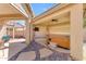 Inviting back patio with a hot tub, ceiling fan, and TV for ultimate relaxation and outdoor entertainment at 4638 S San Benito Ct, Gilbert, AZ 85297