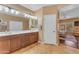 Spacious bathroom with double sink vanity, great lighting, and adjacent bedroom access at 4638 S San Benito Ct, Gilbert, AZ 85297