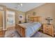 Comfortable bedroom with wood bed frame, ceiling fan, and neutral color scheme throughout at 4638 S San Benito Ct, Gilbert, AZ 85297