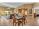 The dining room features ample natural light, tile floors, and access to the patio at 4638 S San Benito Ct, Gilbert, AZ 85297