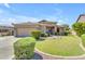 Charming single-story home featuring a well-manicured lawn and desert landscaping at 4638 S San Benito Ct, Gilbert, AZ 85297