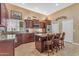 Kitchen with tile floor, stainless steel appliances, and granite counters at 4638 S San Benito Ct, Gilbert, AZ 85297