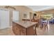 Bright kitchen area with an island, tile floor, and breakfast table with chairs at 4638 S San Benito Ct, Gilbert, AZ 85297