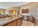 Spacious kitchen with an island, stainless steel appliances, and breakfast table with chairs at 4638 S San Benito Ct, Gilbert, AZ 85297
