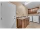 Efficient laundry room boasts updated appliances, granite countertops, and convenient sink at 4638 S San Benito Ct, Gilbert, AZ 85297