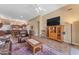 Spacious living room with tile floors and comfortable seating arrangements at 4638 S San Benito Ct, Gilbert, AZ 85297