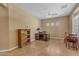 A spacious living room with large windows and tile flooring at 4638 S San Benito Ct, Gilbert, AZ 85297