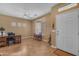 A living room with tile flooring and a white front door at 4638 S San Benito Ct, Gilbert, AZ 85297