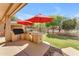 Fully equipped outdoor kitchen with a grill and countertop is great for outdoor entertaining and cooking at 4638 S San Benito Ct, Gilbert, AZ 85297