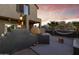 Outdoor kitchen area featuring a pizza oven and a fire pit, perfect for outdoor entertaining at 470 N 168Th Ln, Goodyear, AZ 85338