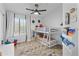 Charming bedroom featuring a bunk bed, ceiling fan, and neutral-toned rug at 470 N 168Th Ln, Goodyear, AZ 85338