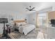 Bright and spacious bedroom with a ceiling fan, and a workout bike at 470 N 168Th Ln, Goodyear, AZ 85338