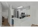 Well-lit kitchen with modern appliances, stylish countertops, and ample cabinet space at 470 N 168Th Ln, Goodyear, AZ 85338