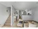 Cozy living space with staircase, comfortable seating, and an open floor plan layout at 470 N 168Th Ln, Goodyear, AZ 85338