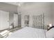 Bright bedroom with a ceiling fan, white comforter on the bed, and grey flooring at 520 N Stapley Dr # 286, Mesa, AZ 85203