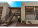 Exterior view of the apartment complex featuring stairs leading to second floor units and landscaped grounds at 520 N Stapley Dr # 286, Mesa, AZ 85203
