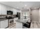 Modern kitchen features stainless steel appliances and breakfast bar with seating at 520 N Stapley Dr # 286, Mesa, AZ 85203