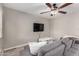 Cozy living room features a modern ceiling fan and a comfortable gray sofa at 520 N Stapley Dr # 286, Mesa, AZ 85203