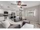 Open concept living space with kitchen view, and stylish gray sectional couch at 520 N Stapley Dr # 286, Mesa, AZ 85203
