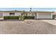 Charming single-story home with desert landscaping and a two-car garage at 5865 E Anaheim St, Mesa, AZ 85205