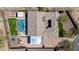 Birds eye view of the backyard with pool, spa, outdoor kitchen, and recreation area at 6328 W Fetlock Trl, Phoenix, AZ 85083