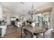 A dining area that showcases a large round table and is adjacent to the gourmet kitchen at 6328 W Fetlock Trl, Phoenix, AZ 85083