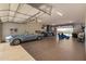 Oversized garage with epoxy flooring offering plenty of space for storage, hobbies, and parking at 6328 W Fetlock Trl, Phoenix, AZ 85083