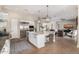 Open kitchen with white cabinets, stainless steel appliances, and granite countertops at 6328 W Fetlock Trl, Phoenix, AZ 85083