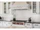 Close-up of the gourmet kitchen featuring high-end appliances, custom cabinets, and a stylish backsplash at 6328 W Fetlock Trl, Phoenix, AZ 85083