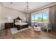 The main bedroom features an inviting layout, hardwood floors, and ample natural light at 6328 W Fetlock Trl, Phoenix, AZ 85083