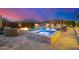 Outdoor pool and hot tub with a bar and built-in fire pit perfect for entertaining at 6328 W Fetlock Trl, Phoenix, AZ 85083