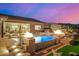 Inviting pool and spa featuring fire bowls and an expansive patio for outdoor relaxation and entertaining at 6328 W Fetlock Trl, Phoenix, AZ 85083
