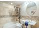 Cozy bathroom features a tiled shower, vanity with sink and a round mirror at 6545 E Ponderosa Loop, Gold Canyon, AZ 85118