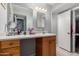 A clean bathroom vanity, sink, vanity lighting, and a framed mirror at 711 E Laurel Dr # 17, Casa Grande, AZ 85122
