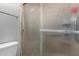 Bathroom shower with textured glass door and silver towel rack adding convenience at 711 E Laurel Dr # 17, Casa Grande, AZ 85122