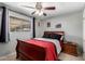 Bedroom featuring ceiling fan, window, and red bedding at 711 E Laurel Dr # 17, Casa Grande, AZ 85122