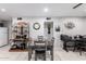 Bright dining area featuring a stylish table set, decorative shelving, and a view of the kitchen at 711 E Laurel Dr # 17, Casa Grande, AZ 85122