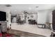 Open-concept dining area adjacent to the kitchen, featuring tiled flooring and neutral wall colors at 711 E Laurel Dr # 17, Casa Grande, AZ 85122