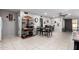 A comfortable dining room features tile floors, stylish shelving, and a dining table at 711 E Laurel Dr # 17, Casa Grande, AZ 85122