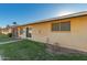 A neutral toned single story home features a well-maintained front lawn and walkway at 711 E Laurel Dr # 17, Casa Grande, AZ 85122