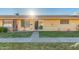 Inviting single story home features a well-maintained front lawn, walkway, and neutral paint at 711 E Laurel Dr # 17, Casa Grande, AZ 85122