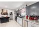 A well-appointed kitchen featuring stainless steel appliances, and tiled flooring at 711 E Laurel Dr # 17, Casa Grande, AZ 85122